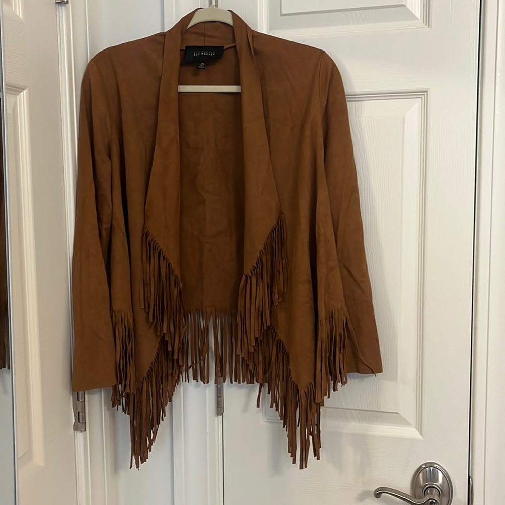 Roasted chestnut color jacket. Sleek suede feel with fringe.